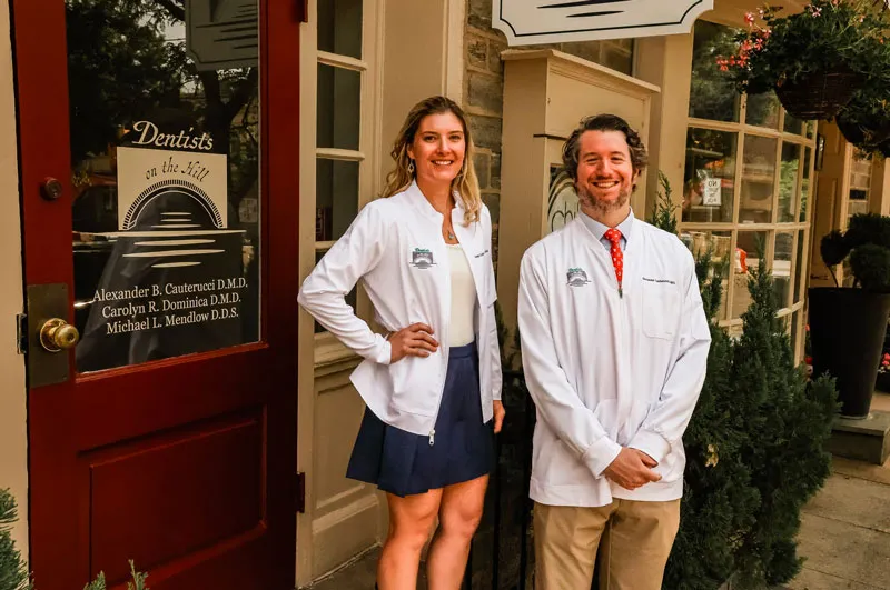 Dr. Carly and Dr. Alex in front of the dental office.